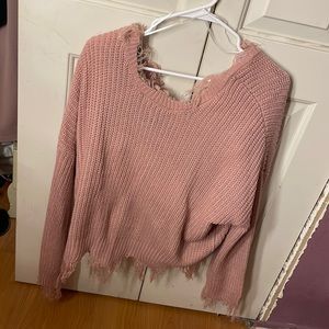 Selling a pink knitted sweater